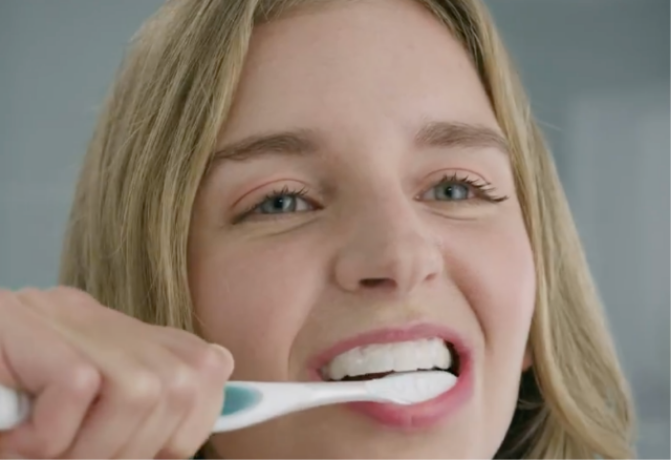 Woman brushing her teeth Woman brushing her teeth